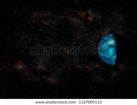 front view of deep space. An half illuminated planet with galaxies and stars in the background. Image taken using food.