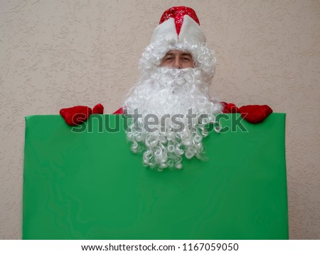 Father Frost holds a banner. New Year's character near. The model for design. Green Screen
