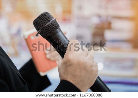 Seminar Conference Concept: Smart businessman speech and speaking with microphones in seminar room or talking conference hall light with microphone and keynote. Event light convention hall Background