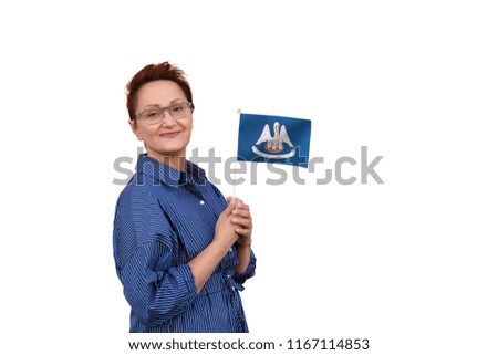 Louisiana flag. Woman holding Louisiana state flag. Nice portrait of middle aged lady 40 50 years old with a state flag isolated on white background.