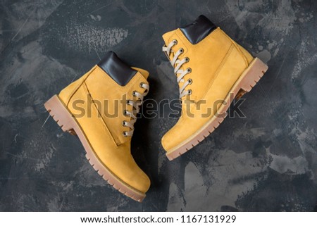 Women's winter boots. Yellow warm boots for trekking. Royalty-Free Stock Photo #1167131929