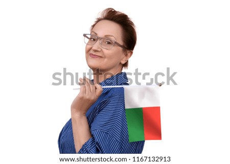 Madagascar flag. Woman holding Madagascar flag. Nice portrait of middle aged lady 40 50 years old with a national flag isolated on white background.