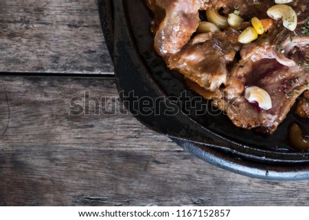 T-bone steak on wood table