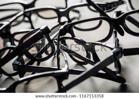 A lot of 3d glasses on a white background. Eyeglasses frames texture.