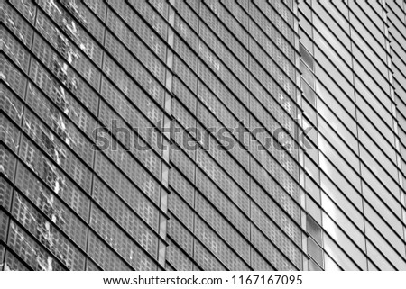 close up section of windows on a modern office building in black and white