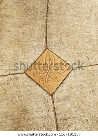 Leaves image of sidewalk tile pattern. Seamless tile swatch included for easy editing. 