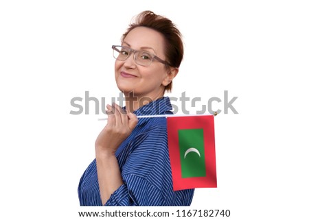 Maldives flag. Woman holding Maldives flag. Nice portrait of middle aged lady 40 50 years old with a national flag isolated on white background.