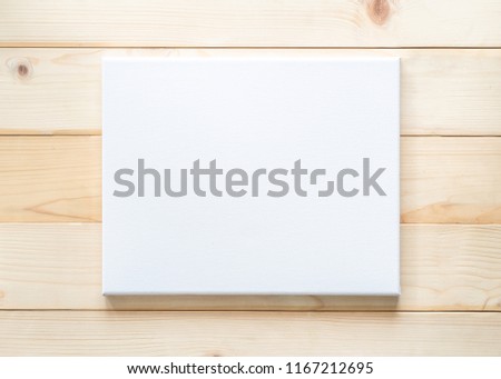 Blank canvas frame mockup square size on white wood wall for arts painting and photo hanging interior decoration