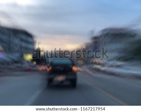 Defocused image, Motion movement with vehicle on street at evening rush hour, traffic in the city.