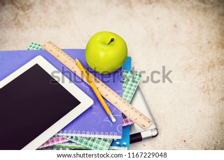 Apple iPad on a Stack of Books