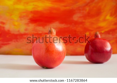 Fresh Whole pomegranate on colourful background