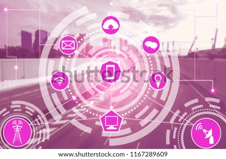 Smart city wireless communication network with graphic showing concept of internet of things (IOT) and information communication technology (ICT) against modern city buildings in the background.
