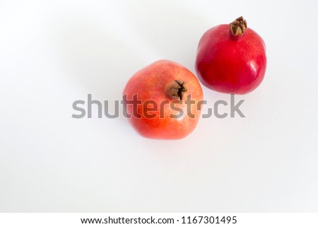 Two Fresh Red Pomegranates  isolated on white background above View