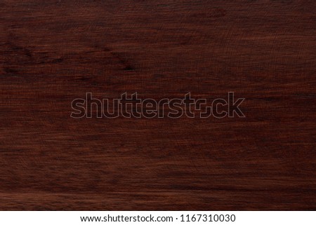 Close-up of natural finished wood surface. Dark brown wooden tetxure