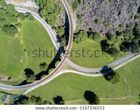 Patten of drone image over the spiral viaduct of Swiss mountain railway in Brusio, Switzerland - aerial photography