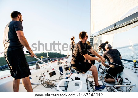 Team athletes Yacht training for the competition Royalty-Free Stock Photo #1167346012