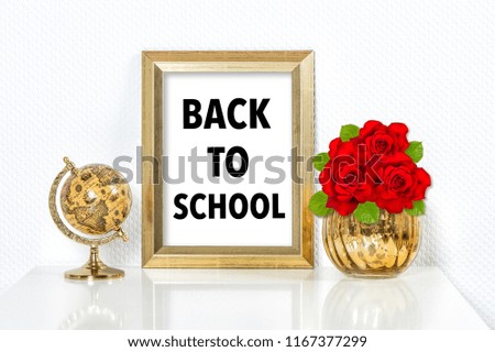 Back to school. Golden picture frame with decorations. Vase and globe no name products