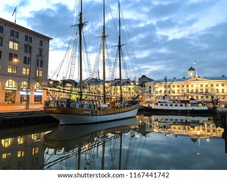 This is a picture of an old sailing ship in Helsinki Harbour at sunset