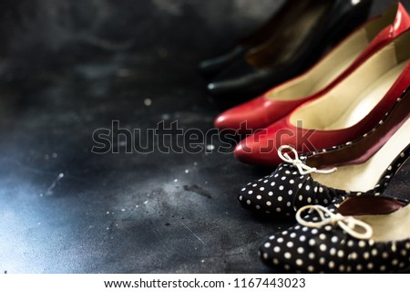 Black friday sale concept on black surface, women hills shoes