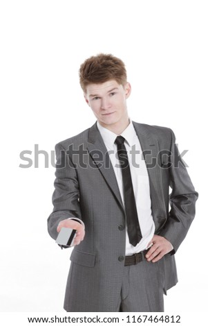 successful businessman holding out a blank business card.