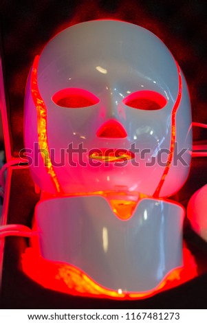 Professional Galvanic Regeneration LED Light Facial Mask . THERAPY FACIAL . Neo-elegance LED Illumination .  Royalty-Free Stock Photo #1167481273