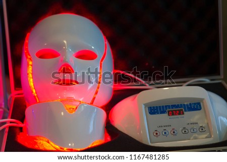 Professional Galvanic Regeneration LED Light Facial Mask . THERAPY FACIAL . Neo-elegance LED Illumination .  Royalty-Free Stock Photo #1167481285