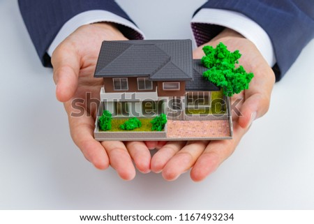 Housing Sales and Home Plastic Model(Image of real estate, home purchase, home sales) Royalty-Free Stock Photo #1167493234
