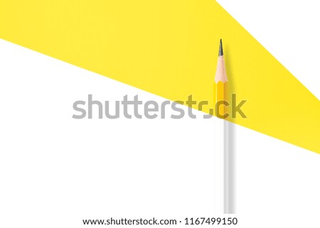 Minimalist template with copy space by top view close up macro photo of yellow pencil isolated on yellow paper and combine with black and white filter. Flash light made smooth highlight on pencil.