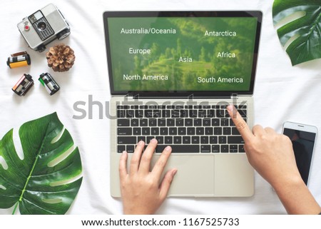 Flat Lay Holiday Travel Background of Creative Idea with Trip Planning , Copy Space on Laptop Monitor with Clipping Path Selection for your Design or Montage