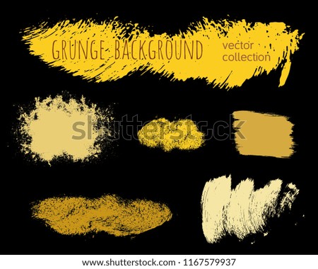 Set of golden ink vector stains. Grunge brush collection isolated on black