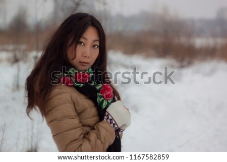beautiful asian girl warmly dressed in winter