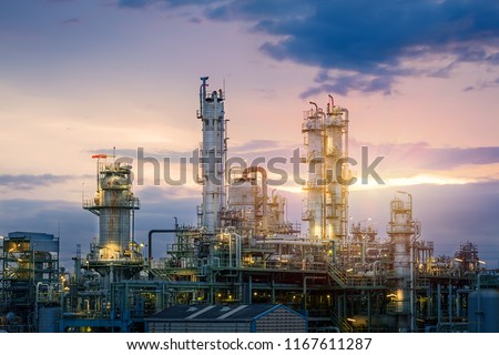Oil and gas refinery plant or petrochemical industry on sky sunset background, Factory at evening, Manufacturing of petroleum industrial plant Royalty-Free Stock Photo #1167611287