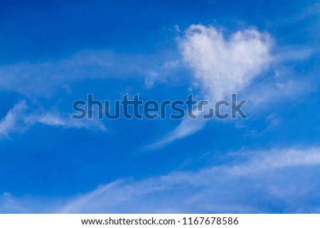 Beautiful image in nature. Perfect of real heart shaped from white softy cloud shown on cloudy blue sky. Background for love picture or business target or meteorology or inspiration concept