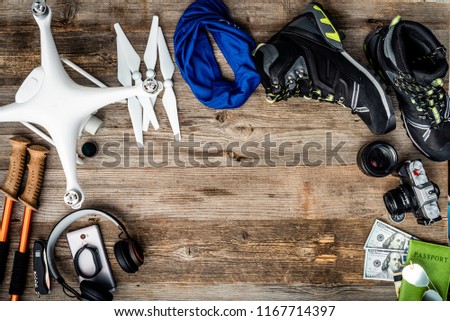 Travelling must have equipment on the wooden background