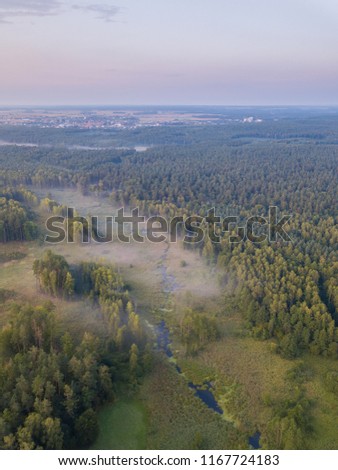 Beautiful misty evening landscape photographed from drone. Magical atmosphere.