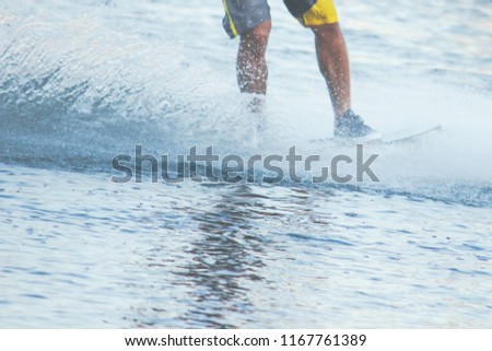 Young man surfing on wakeboard