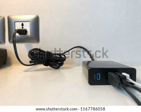 Adapter power. USB type C  PD and standard. 3 port charging mobile, camera and pocket wifi. Multi device charging it's convenient when you travel. Copy space for text. Royalty-Free Stock Photo #1167786058