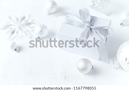 An arrangement of gift boxes and Christmas decorations on white background. Symbolic image. Close up. Copy space