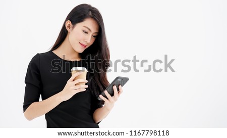 Entrepreneur pretty woman holding coffee cup and touching screen on smart phone mobile on white background, attractive asian people drink beverage  smart, Technology communication lifestyles concept.