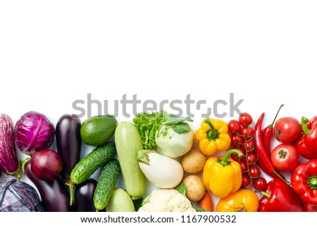 line made of different vegetables and berries isolated on white background. Copy space. Healthy eating background. Food photography. Top view