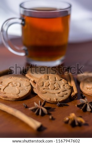 Gingerbread on the table with the ingredients and cup of tea