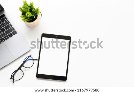 Top view tablet,smartphone ,mouse and keyboard on office desk.Top view with copy space.