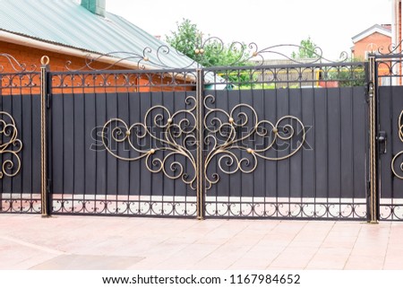 Automatic gates with a forged decor in a private house
