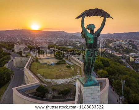 Budapest, Hungary - Aerial view of the Statue of Liberty at sunset with Buda Castle Royal Palace at background Royalty-Free Stock Photo #1168033522