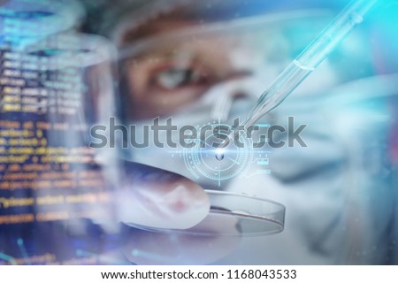 In a futuristic laboratory, a scientist with a pipette analyzes a colored liquid to extract the DNA and molecules in the test tubes. Concept:research,biochemistry,immersive technology,augmented reality
