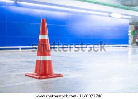 Orange funnel of traffic cone with white stripes, copy space on 