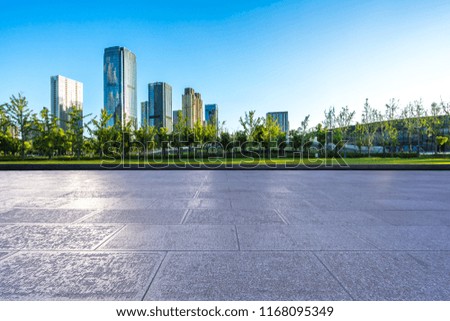 empty square with city skyline in hangzhou china
