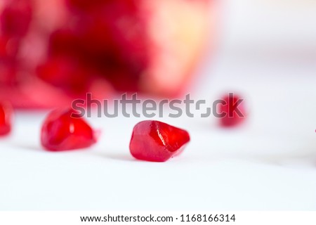 Pomegranate seed pile isolated on white background MACRO