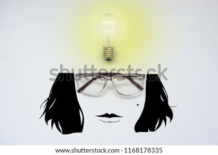 Glasses and a light bulb with a cartoon face, top view, white background