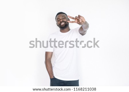 Young african american man pointing to camera with fingers isolated on white background